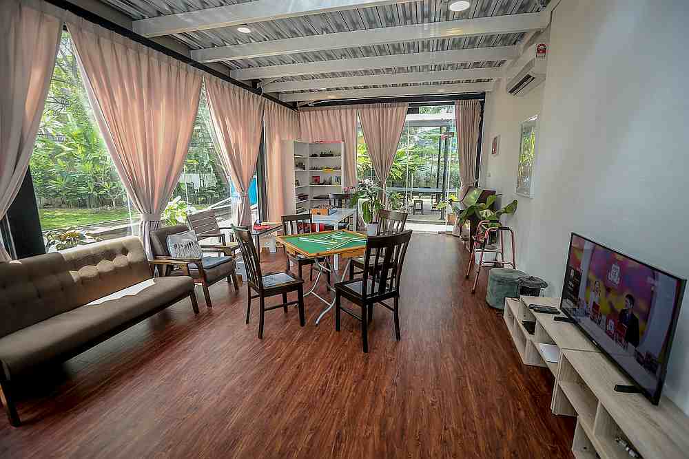 The living room is decked out with comfortable couches, a mahjong table, and a special area displaying the residentsu00e2u20acu2122 creations from the arts and crafts classes. u00e2u20acu201d Picture by Firdaus Latifn