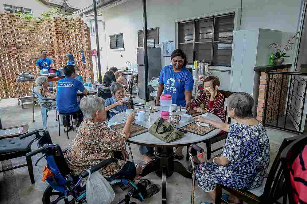 Lunchtime is an exciting affair where the residents gather in the communal area to enjoy their meal as jazzy tunes filter out of the speakers. — Picture by Firdaus Latif