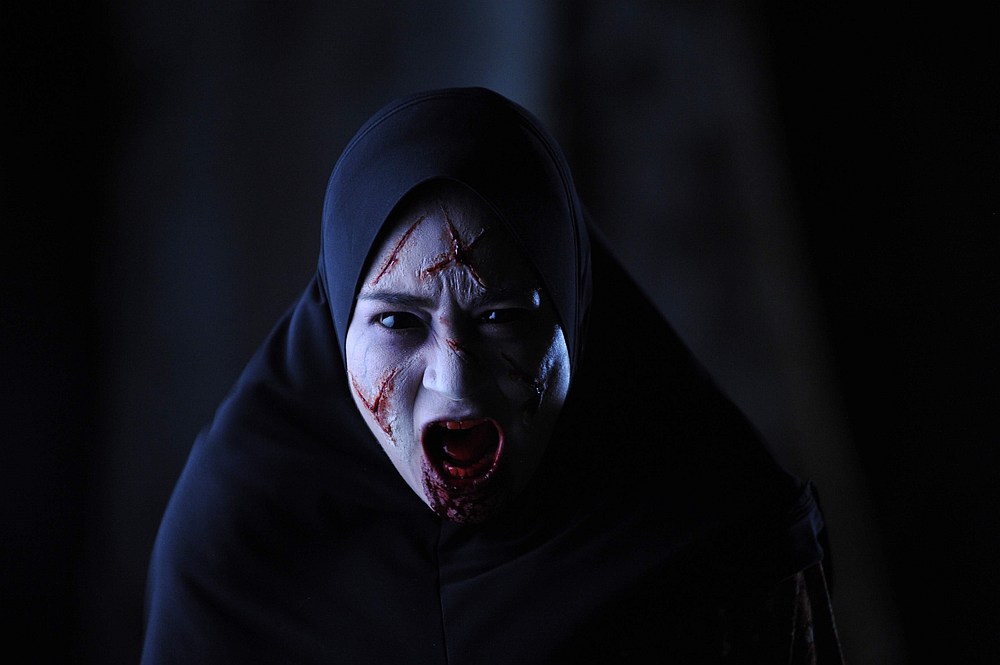 Maya Karin stars in the supernatural thriller 'Munafik 2.' u00e2u20acu201d Image courtesy of Netflix