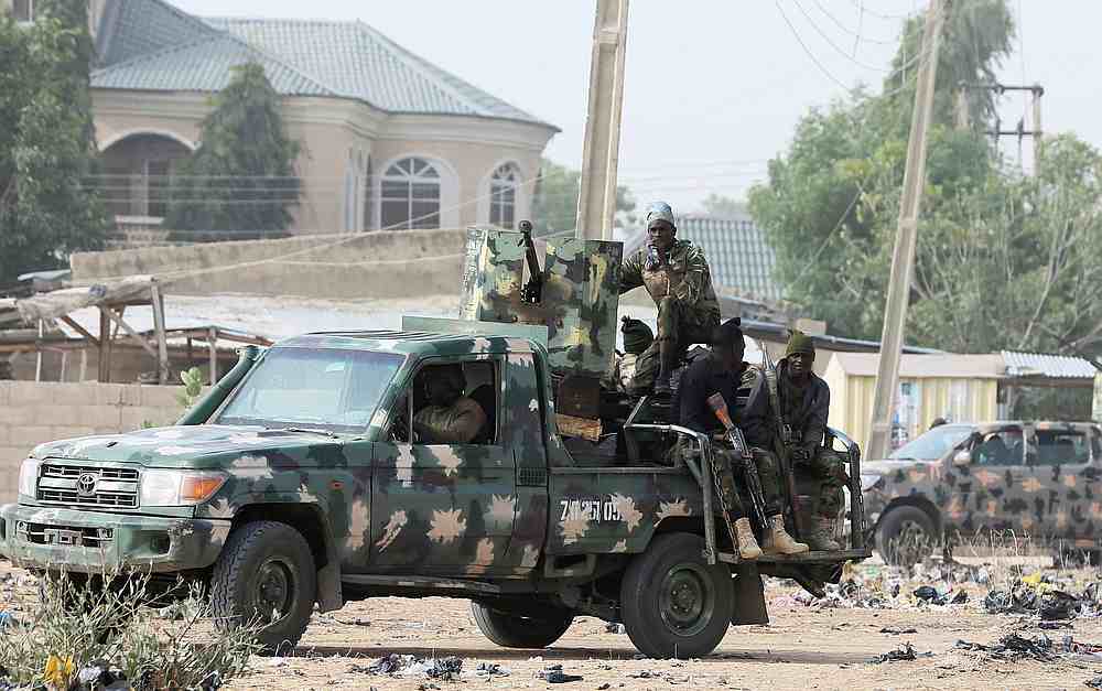 Nigerian military secure an area where a man was killed by suspected militants near Maiduguri, Nigeria, February 16, 2019. u00e2u20acu201d Reuters pic