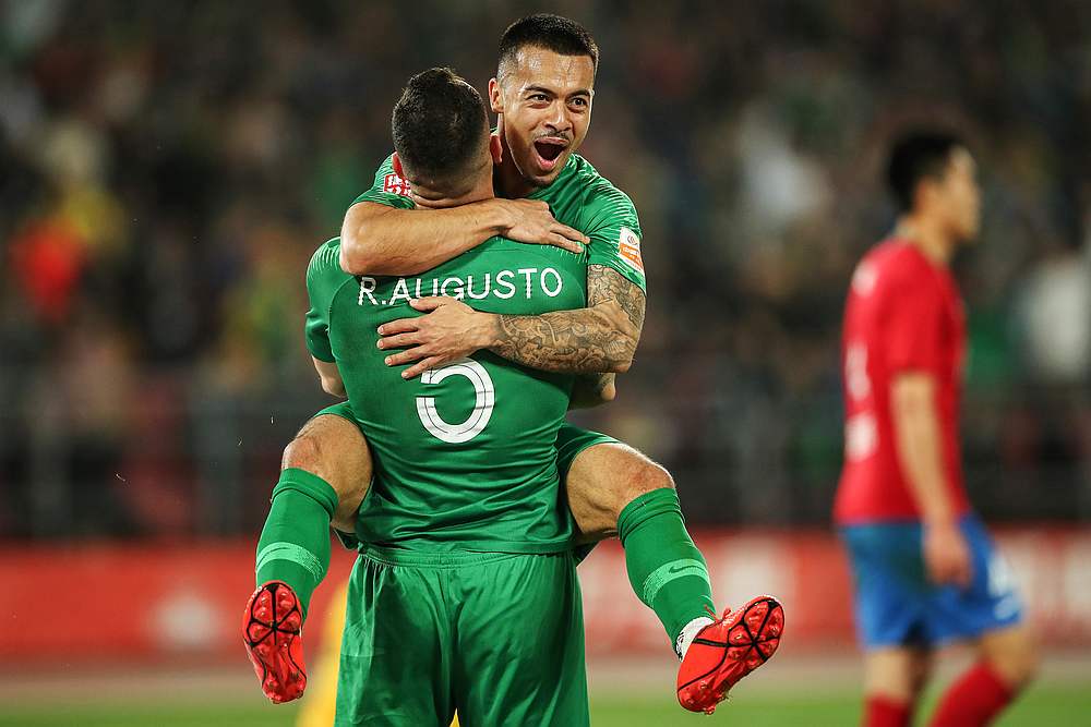 Nico Yennaris (top), also known as Li Ke, of Beijing Guoan celebrating with teammate Renato Augusto after scoring during their Chinese Super League match in Beijing April 14, 2019. u00e2u20acu201d AFP pic