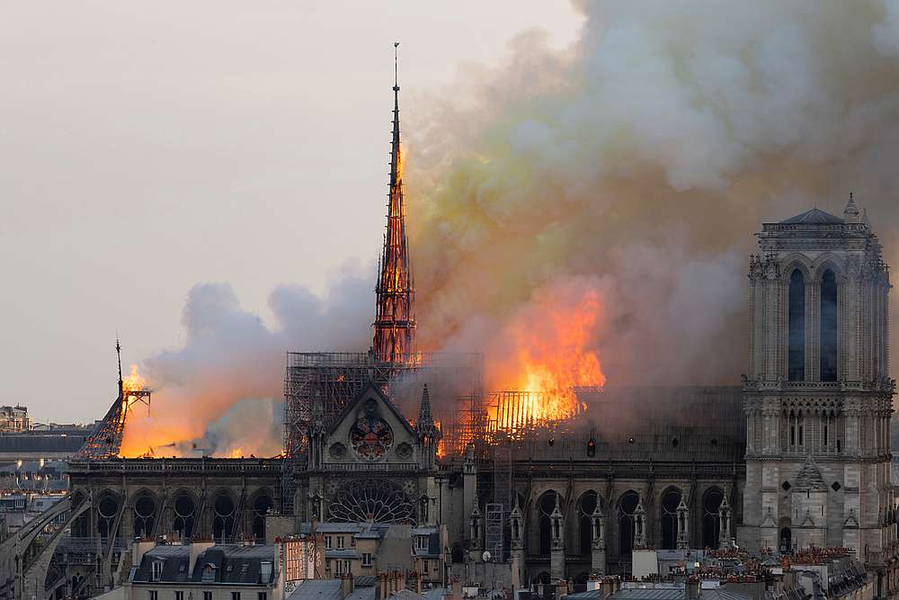 Flames burning through the roof of the Notre-Dame de Paris Cathedral in Paris April 15, 2019. u00e2u20acu201d AFP pic
