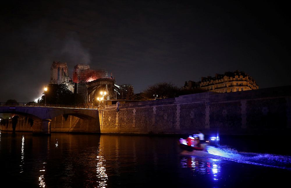 Firefighters douse flames from the burning Notre Dame Cathedral in Paris, France April 15, 2019. u00e2u20acu201d Reuters pic