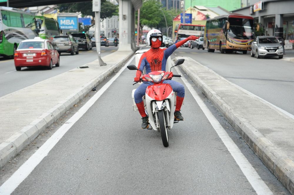 This postman knows that with great power comes great responsibility. u00e2u20acu201d Picture courtesy of Pos Malaysia Berhad