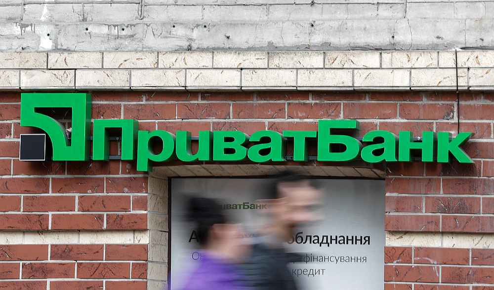 People walk past a branch of PrivatBank, the country's biggest lender, in Kiev, Ukraine April 18, 2019. u00e2u20acu201d Reuters pic