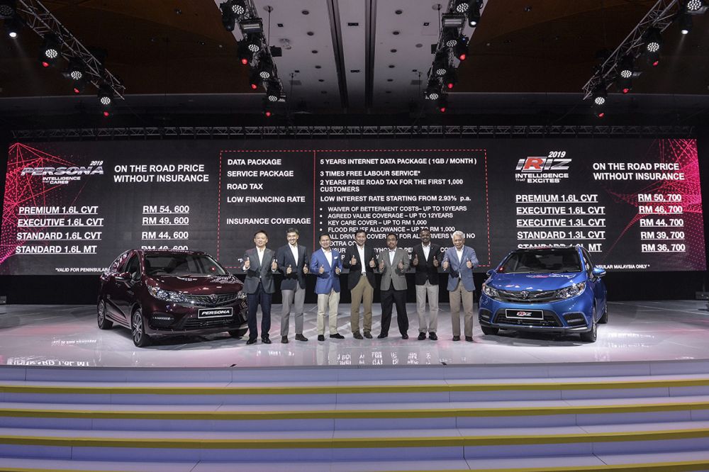 Proton chairman Datuk Seri Syed Faisal Albar (third from left) poses for the camera during the launch of the all new Proton Persona and Iriz at the Kuala Lumpur Convention Centre in Kuala Lumpur April 23, 2019. u00e2u20acu201d Picture by Shafwan Zaidon
