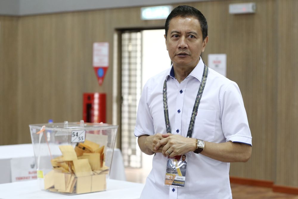 Election Commission chairman Azhar Azizan Harun inspects early voting proceedings at the Sendayan Air Force base April 9, 2019. u00e2u20acu201d Picture by Yusof Mat Isa