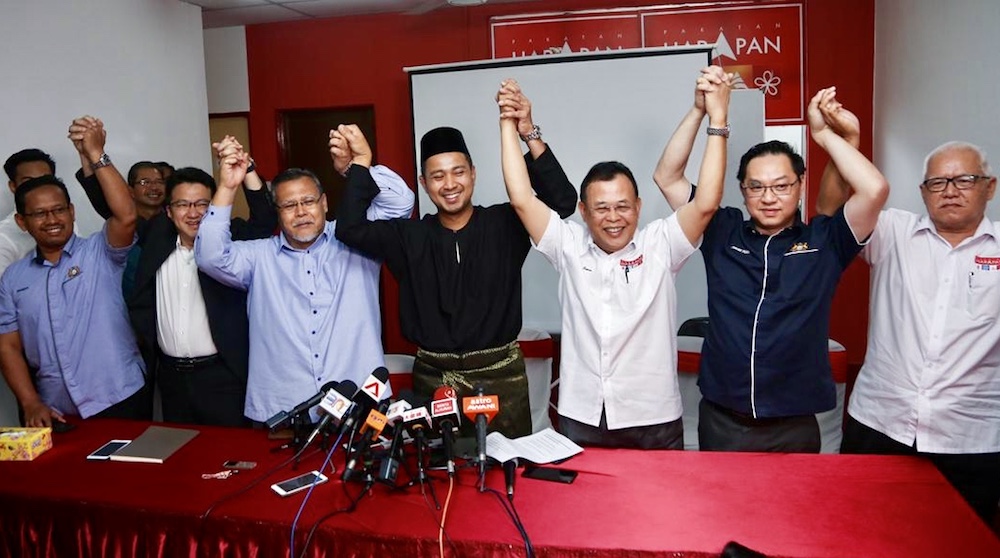 Dr Sahruddin Jamal (centre in black) and senior Johor Pakatan Harapan (PH) leaders during his maiden press conference as the stateu00e2u20acu2122s new mentri besar in Johor Baru April 14, 2019. u00e2u20acu201d Picture by Ben Tan