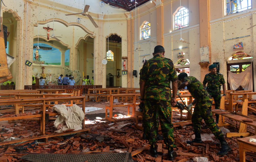 Security personnel inspect the interior of St Sebastianu00e2u20acu2122s Church in Negombo April 22, 2019, a day after the church was hit in series of bomb blasts targeting churches and luxury hotels in Sri Lanka. u00e2u20acu201d AFP pic 