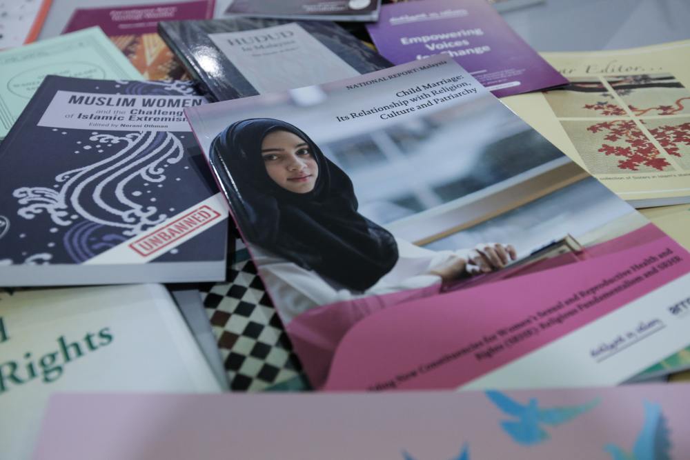 Some of the many booklets published by SIS over the years. ― Picture by Ahmad Zamzahuri