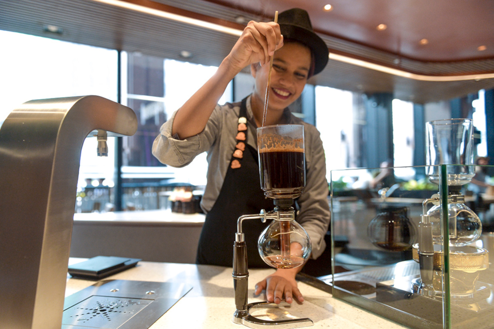 Isabel Russel preparing coffee using the siphon brewing method. u00e2u20acu201d Picture by Mukhriz Hazim
