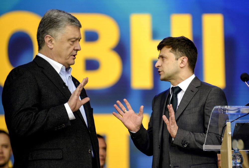 Ukrainian President Petro Poroshenko (left) speaks with presidential candidate Volodymyr Zelensky during a presidential election debate at Olimpiyski stadium in Kiev on April 19, 2019. u00e2u20acu201d AFP pic