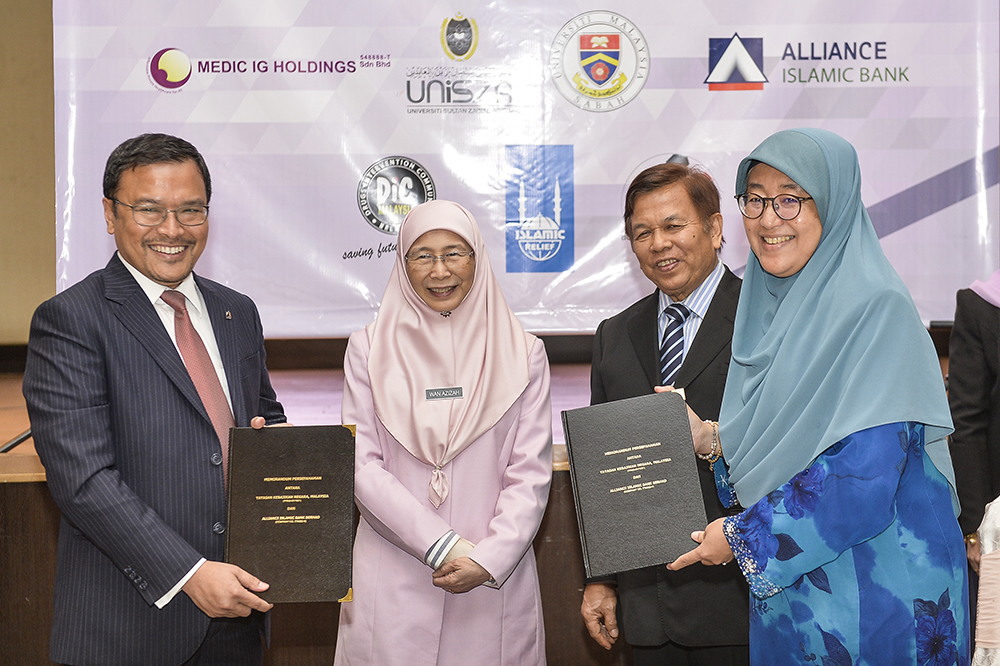 Datuk Seri Dr Wan Azizah Wan Ismail witnesses the signing of an MoU between Yayasan Kebajikan Negara and the Woman, Family and Community Development Ministry in Putrajaya April 15, 2019. u00e2u20acu201d Picture by Miera Zulyana