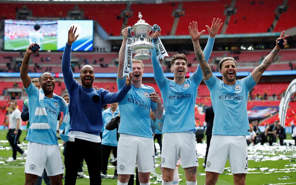 Manchester Cityu00e2u20acu2122s Raheem Sterling, Fabian Delph, Kevin De Bruyne, John Stones and Kyle Walker celebrate with the trophy after winning the FA Cup, May 18, 2019, Wembley Stadium, London. u00e2u20acu201d Reuters pic