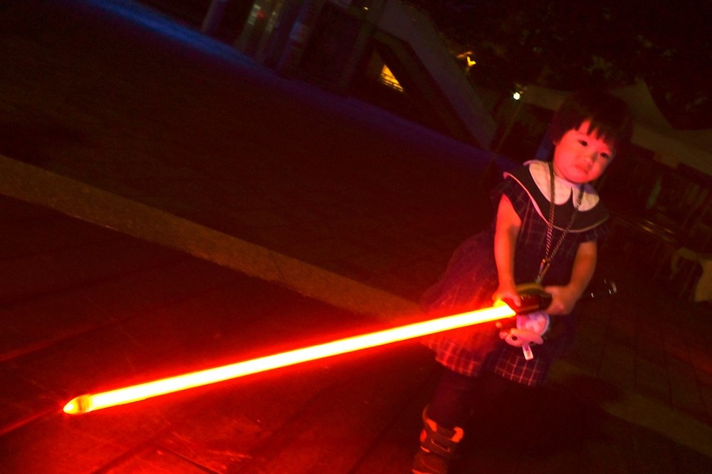 A fan uses a model lightsaber during an event to promote the upcoming unofficial Star Wars Day in Taipei April 20, 2019. u00e2u20acu201d AFP pic