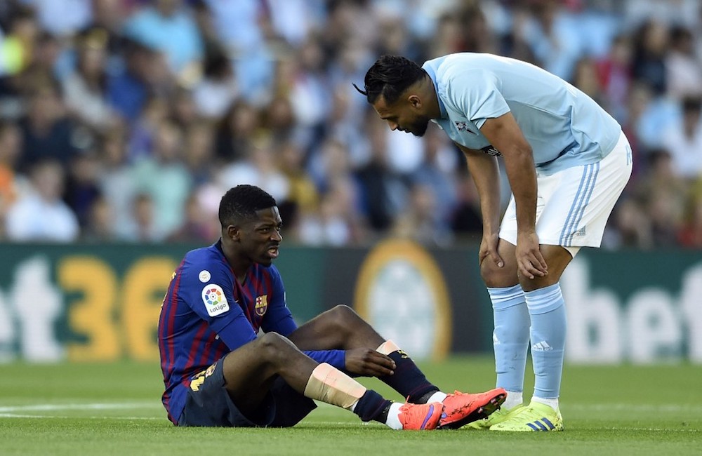 Celta Vigou00e2u20acu2122s midfielder Sofiane Boufal checks on Barcelonau00e2u20acu2122s Ousmane Dembele during their La Liga match at Balaidos Stadium in Vigo May 4, 2019. u00e2u20acu201d AFP pic