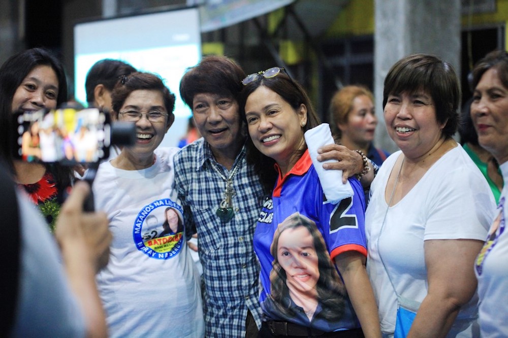 Gertrudes Batocabe (centre), wife of the late congressman Rodel Batocabe, poses for photos with supporters during a campaign rally in the town of Daraga, Albay province April 30, 2019. u00e2u20acu201d AFP pic
