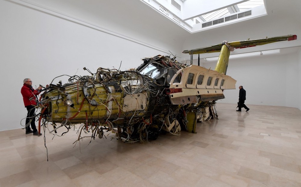 Visitors view ‘Flight’ by Polish artist Roman Stanczak, during a press preview ahead of the opening of the 58th International Venice Biennale May 9, 2019. — AFP pic