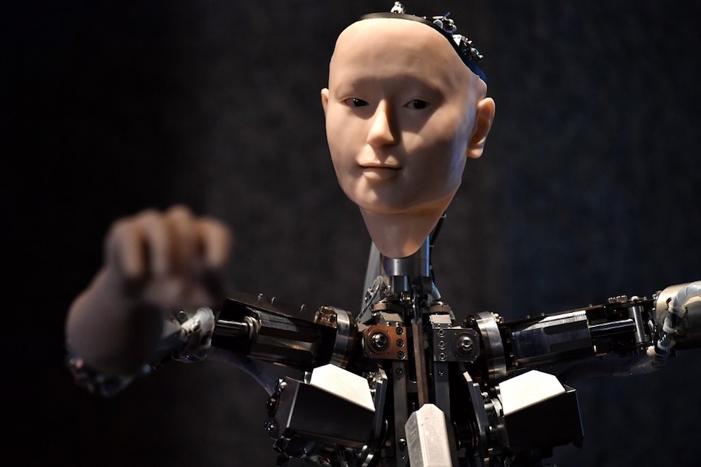 An AI robot with a humanistic face, entitled Alter 3: Offloaded Agency, is pictured during a photocall for the exhibition u00e2u20acu02dcAI: More than Humanu00e2u20acu2122 in London May 15, 2019. u00e2u20acu201d AFP pic
