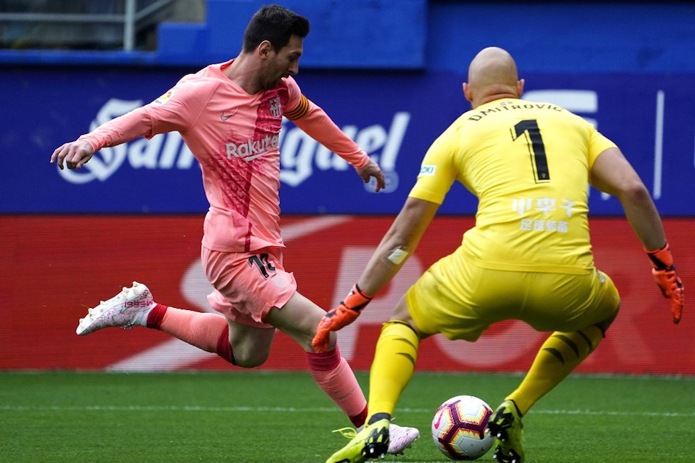 Barcelonau00e2u20acu2122s Lionel Messi scores a goal past Eibaru00e2u20acu2122s goalkeeper Marko Dmitrovic during their La Liga match at the Ipurua stadium in Eibar May 19, 2019. u00e2u20acu201d AFP pic