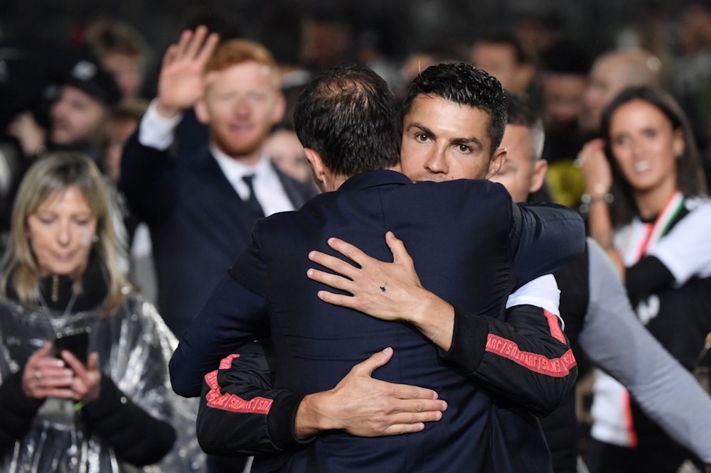 Juventus coach Massimiliano Allegri embraces Cristiano Ronaldo as they celebrate being crowned champions at the end of the Serie A match with Atalanta at the Allianz stadium in Turin May 19, 2019. u00e2u20acu201d AFP pic