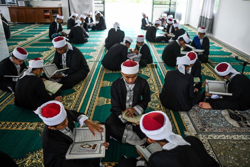 Muslim students read copies of the holy Quran to observe Nuzul al-Quran in a mosque in Bentong May 23, 2019. u00e2u20acu201d AFP pic