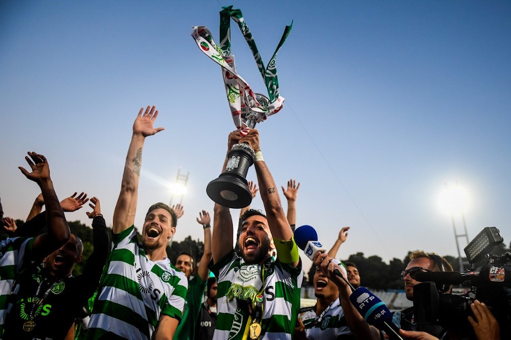 Sportingu00e2u20acu2122s players hold up the trophy after winning the Portugal Cup final with Porto at Jamor stadium in Oeiras May 25, 2019. u00e2u20acu201d AFP pic