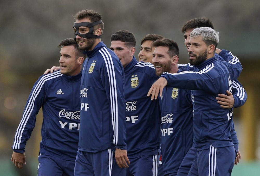Argentinau00e2u20acu2122s Lionel Messi smiles next to teammate Sergio Aguero during a training session in Ezeiza, Buenos Aires May 30, 2019. u00e2u20acu201d AFP pic