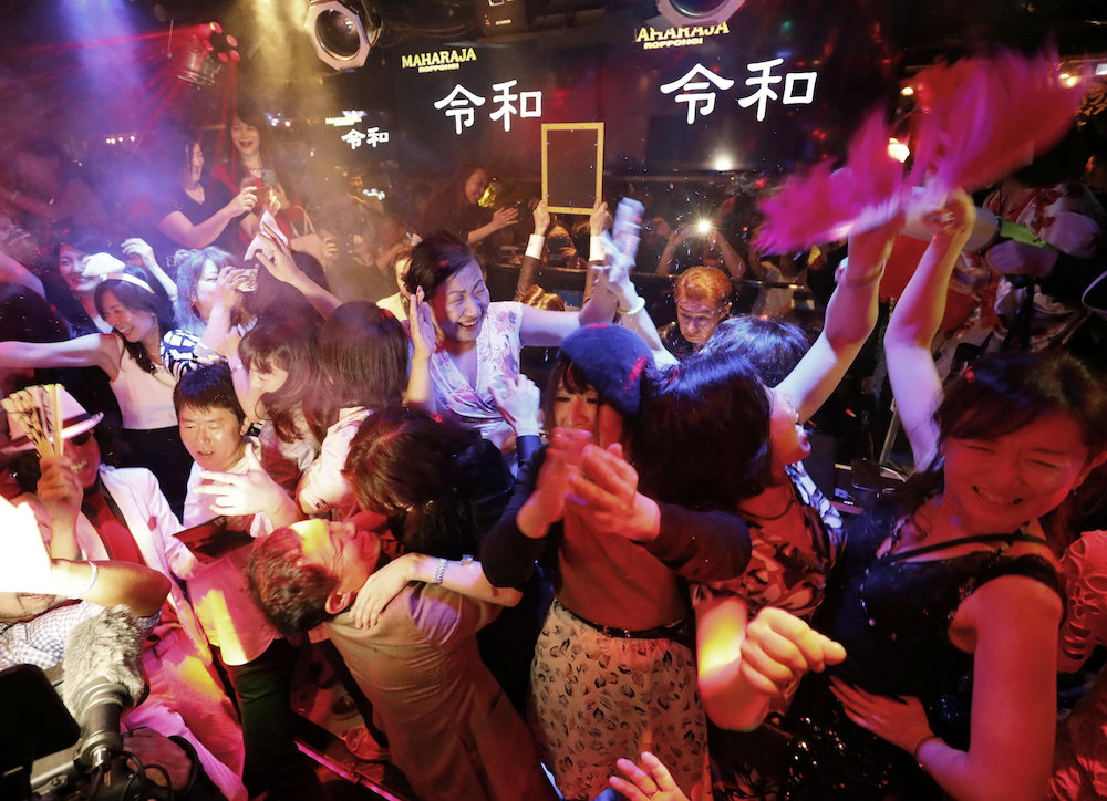 People celebrate the start of Japan's new Reiwa imperial era at the Maharaja nightclub in Tokyo's Roppongi district, Japan May 1, 2019, in this photo taken by Kyodo. u00e2u20acu201d Kyodo handout via Reuters