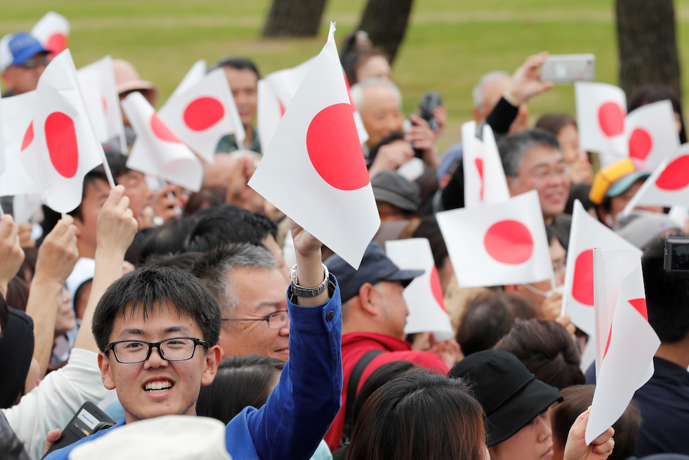People wave Japanese flags as they wait for Emperor Naruhito outside the Imperial Palace in Tokyo May 1, 2019. u00e2u20acu201d Reuters pic