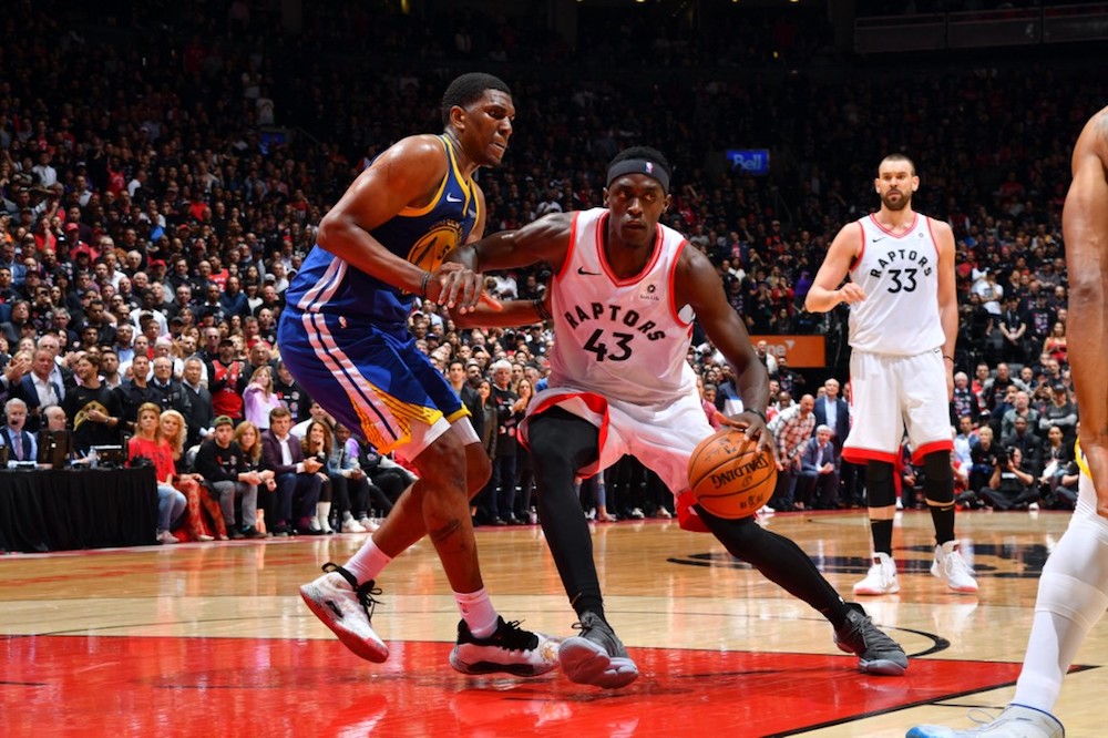Pascal Siakam of the Toronto Raptors handles the ball with Kevon Looney of the Golden State Warriors during Game One of the NBA Finals at Scotiabank Arena in Toronto May 30, 2019. u00e2u20acu201d AFP pic
