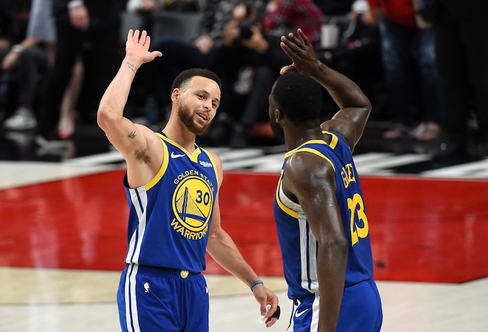 Stephen Curry of the Golden State Warriors celebrates with Draymond Green during the second half against the Portland Trail Blazers in game three of the NBA Western Conference Finals in Portland, Oregon May 18, 2019. u00e2u20acu201d AFP pic