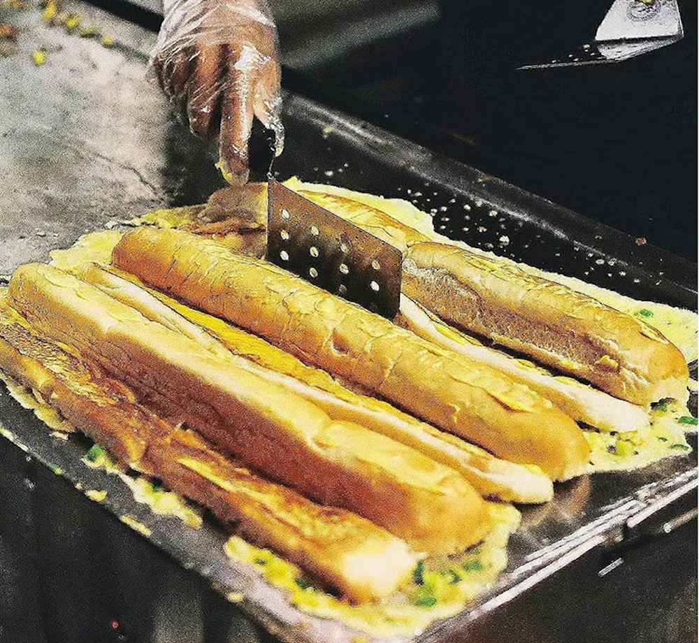 'Roti John', a traditional Malaysian omelette sandwich stuffed with meat, vegetables, cheese and loads of sauces. u00e2u20acu201d Screengrab via Instagram/ Roti John Baba Aliong