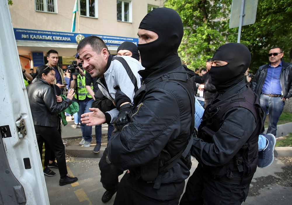 Police officers detain an anti-government protester during a rally calling for a boycott of June presidential elections in Almaty, Kazakhstan May 1, 2019. u00e2u20acu201d Reuters pic