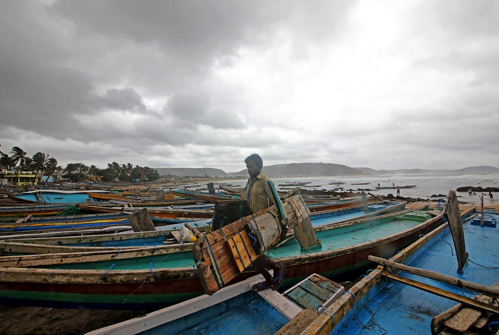 A fisherman carries his tools as he leaves for a safer place after tying his boats along the shore ahead of cyclone Fani in Peda Jalaripeta on the outskirts of Visakhapatnam May 1, 2019. u00e2u20acu201d Reuters pic
