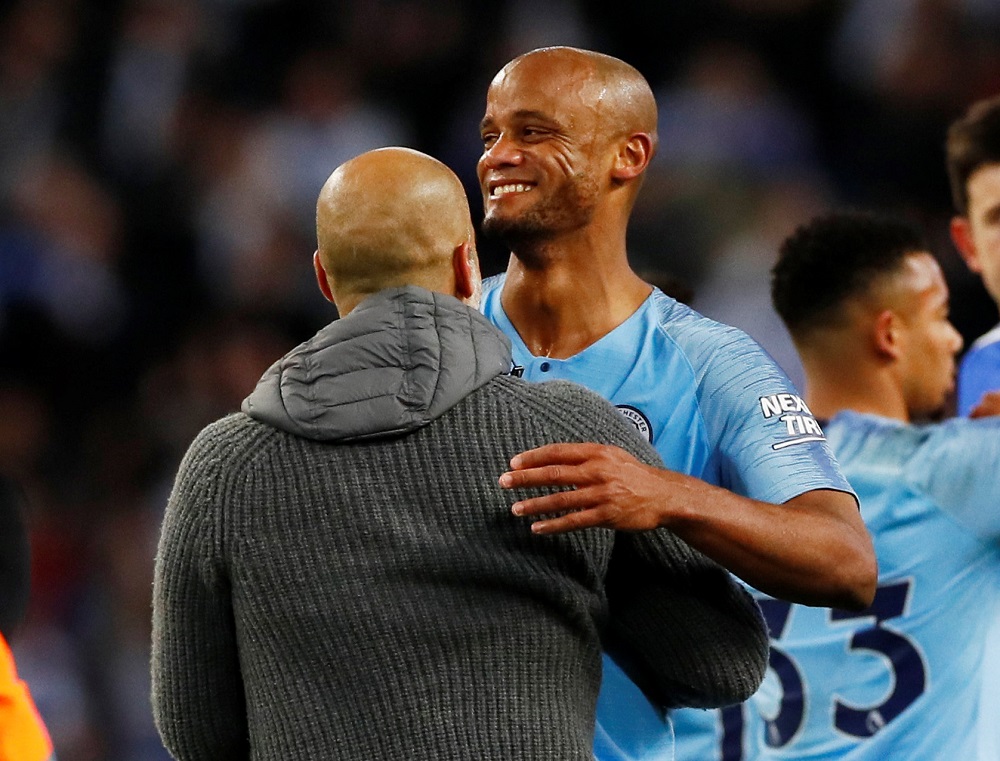 Manchester City manager Pep Guardiola celebrates with Vincent Kompany after the match at the Etihad Stadium in Manchester May 6, 2019. u00e2u20acu201d Action Images via Reuters