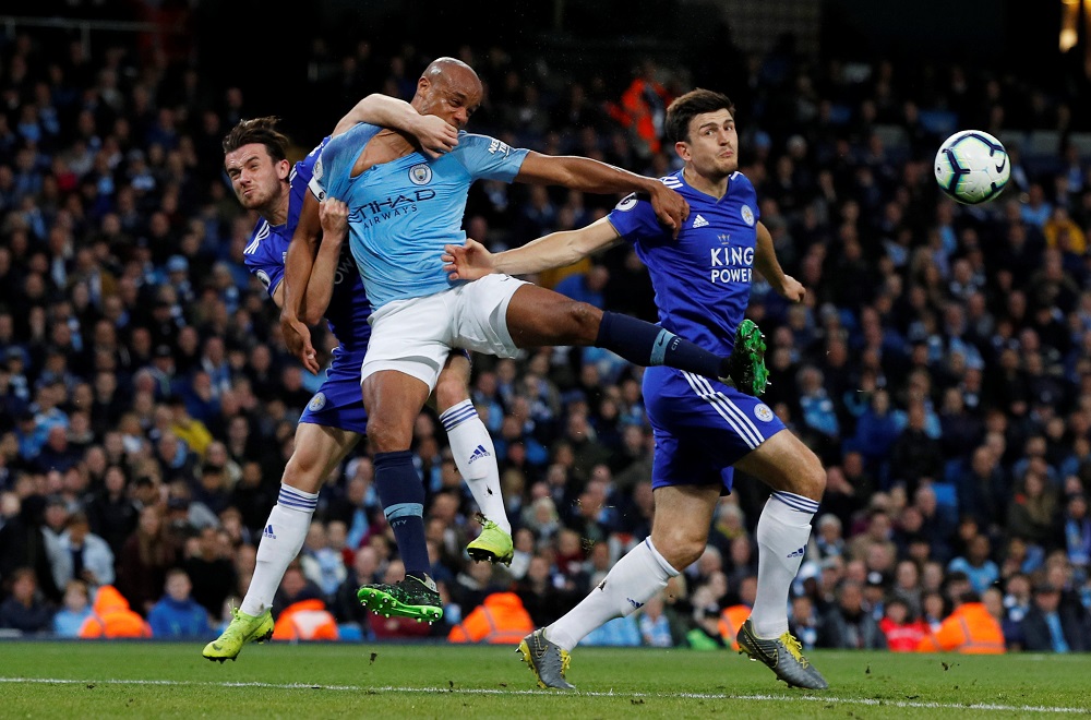 Leicester Cityu00e2u20acu2122s Ben Chilwell and Harry Maguire in action with Manchester Cityu00e2u20acu2122s Vincent Kompany at the Etihad Stadium in Manchester May 6, 2019. u00e2u20acu201d Reuters pic 