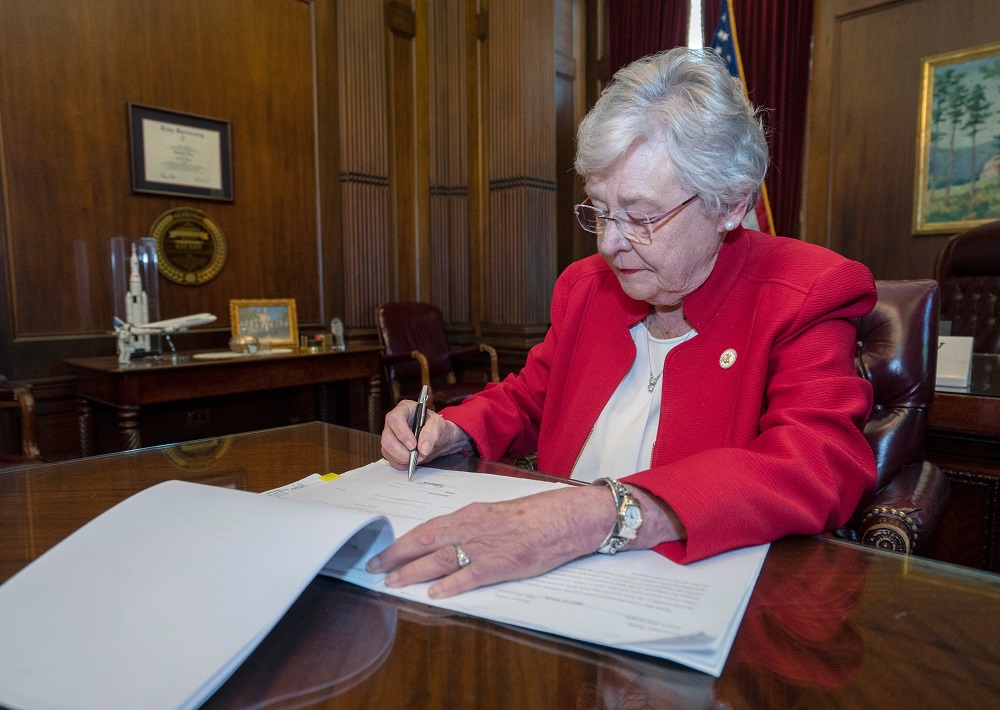 Alabama Governor Kay Ivey signs into law the Alabama Human Life Protection Act, after both houses of the legislature passed the bill, in Montgomery, Alabama May 15, 2019. u00e2u20acu201d Picture courtesy of Office of the Governor State of Alabama via Reuters