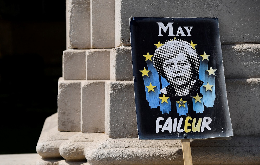 An anti-Brexit placard depicting Briainu00e2u20acu2122s Prime Minister Theresa May is seen near the Houses of Parliament in London May 16, 2019. u00e2u20acu201d Reuters pic