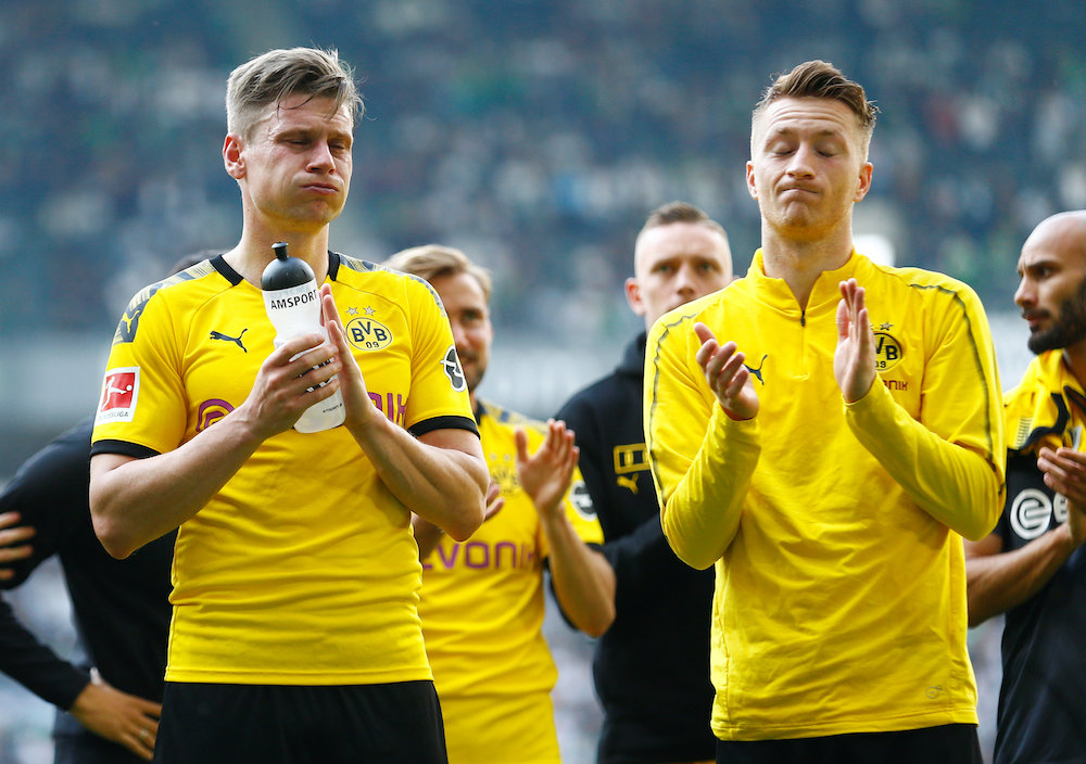 Borussia Dortmundu00e2u20acu2122s Lukasz Piszczek and Marco Reus applaud fans after the Bundesliga match with Borussia Moenchengladbach at Borussia-Park in Moenchengladbach May 18, 2019. u00e2u20acu201d Reuters pic