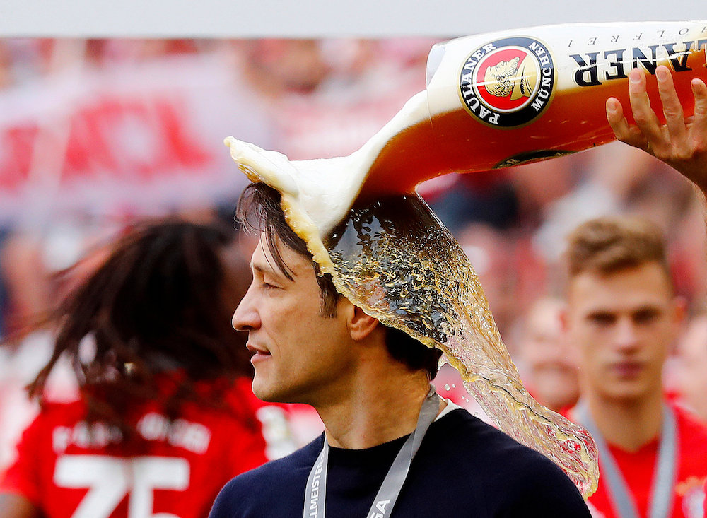 Bayern Munichu00e2u20acu2122s Arjen Robben pours beer on Bayern Munich coach Niko Kovac as they celebrate winning the Bundesliga at the Allianz Arena in Munich May 18, 2019. u00e2u20acu201d Reuters pic