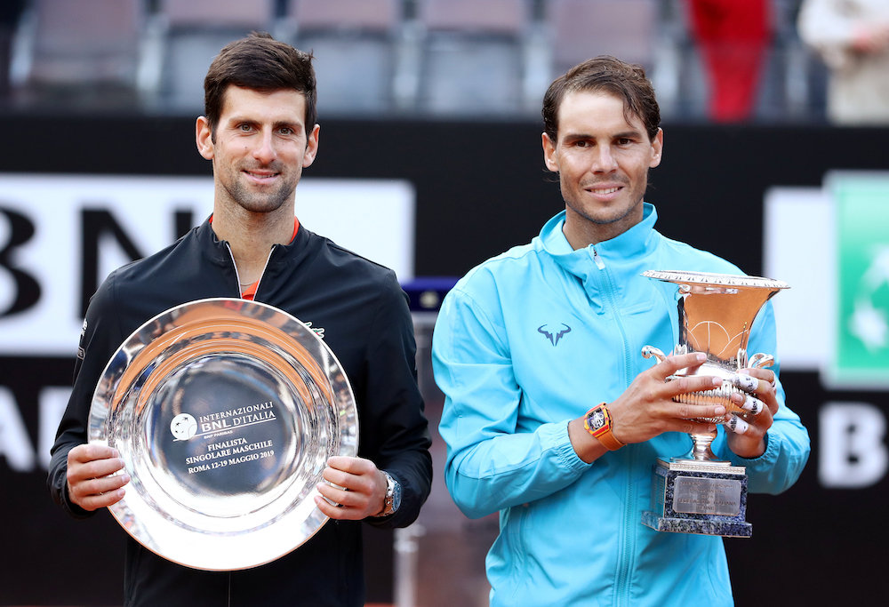Spainu00e2u20acu2122s Rafael Nadal celebrates winning the Italian Open final against Serbiau00e2u20acu2122s Novak Djokovic as they pose with their respective winner and runner up trophies in Rome May 19, 2019. u00e2u20acu201d Reuters pic