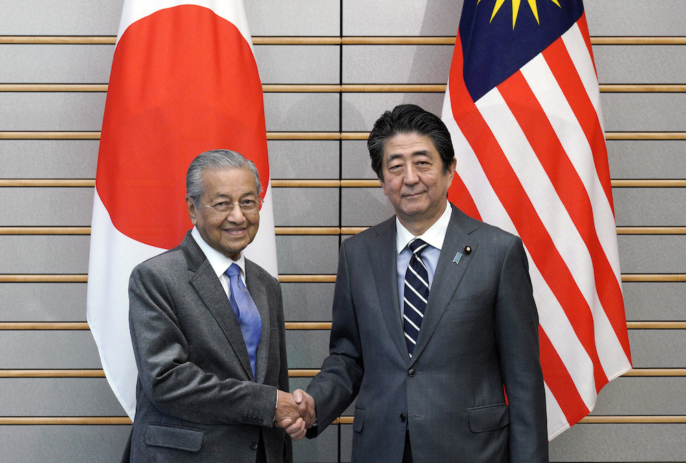 Prime Minister Tun Dr Mahathir Mohamad shakes hands with Japanu00e2u20acu2122s Prime Minister Shinzo Abe at the start of their meeting at Abeu00e2u20acu2122s official residence in Tokyo May 31, 2019. u00e2u20acu201d Reuters pic