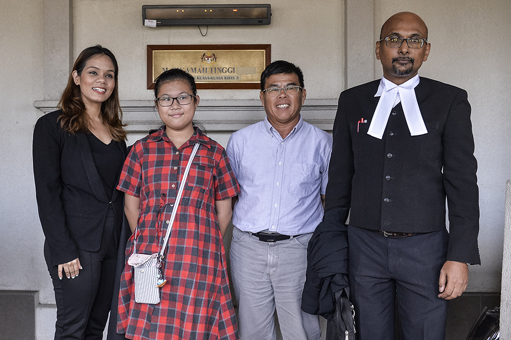 Lew Yee Hong (centre) who successfully sought citizenship for his Perak-born daughter to him and his Filipinawife, is seen here with their lawyers, Larissa Ann Louis and Annou Xavier in High Court Kuala Lumpur on May 2, 2019. u00e2u20acu2022 Picture by Miera Zulyana 