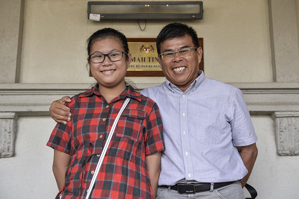 Lew Yee Hong and his Perak-born daughter were happy with the court's decision to declare her as a citizen of the country, May 2, 2019. 