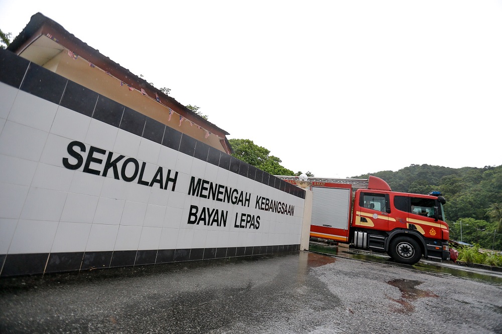 A fire engine is seen leaving SMK Bayan Lepas following a chemical leak scare in Bayan Lepas May 6, 2019. u00e2u20acu201d Picture by Sayuti Zainudin