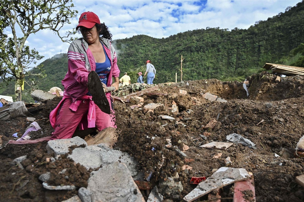 A woman searches for victims after a landslide in Rosas, Valle del Cauca department, in southwestern Colombia April 22, 2019. u00e2u20acu201d AFP pic