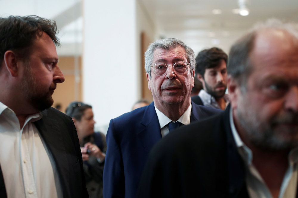 Mayor of Levallois-Perret Patrick Balkany walks behind French lawyer Eric Dupont-Moretti as he arrives for his trial at the Paris courthouse May 13, 2019. u00e2u20acu201d Reuters picnn