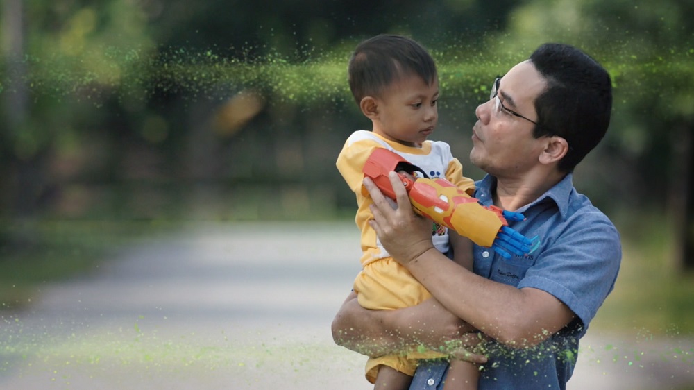 Sujana Mohd Rejab or u00e2u20acu02dcPak Suu00e2u20acu2122 carrying Muhammad Ziqri Ramadan, one of the children who received a prosthetic arm from the former teacher. u00e2u20acu201d Image courtesy of Maxis