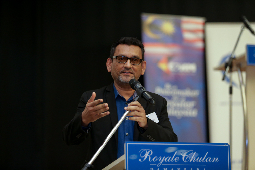Global Unity Network president Shah Kirit Kakulal Govindji speaks before a breaking fast between imams and pastors event in Petaling Jaya May 16, 2019.